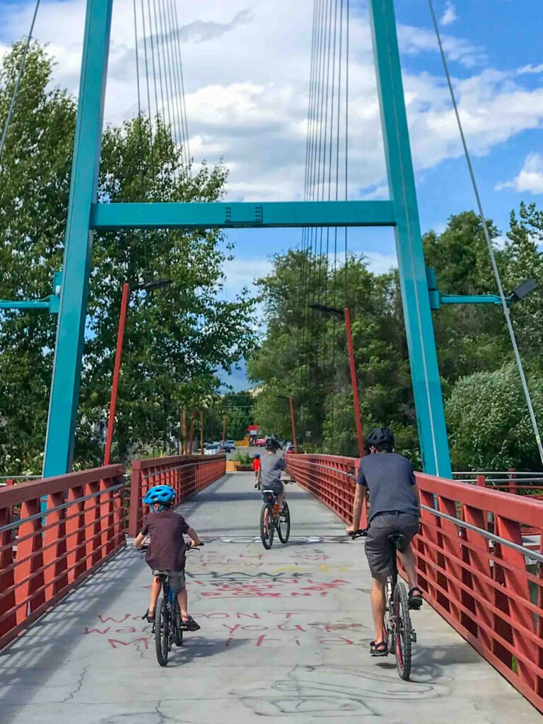 kids biking on bridge