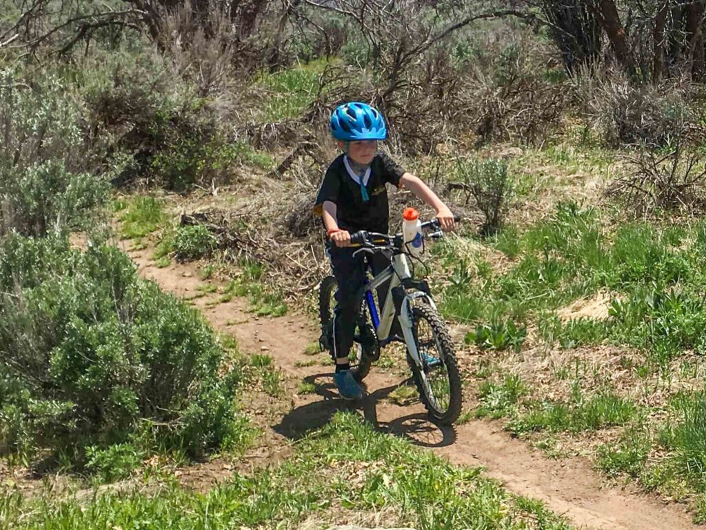 kid riding in a natural bike trail in Indianapolis