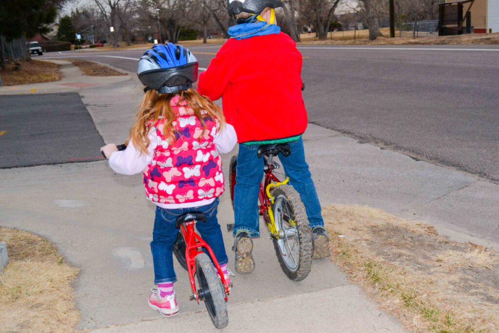 kids riding balance bikes