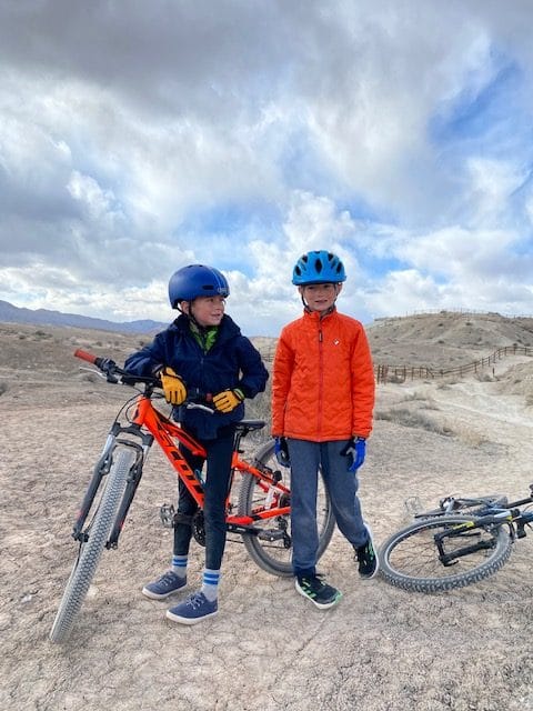 kids biking in the desert on mountain bikes