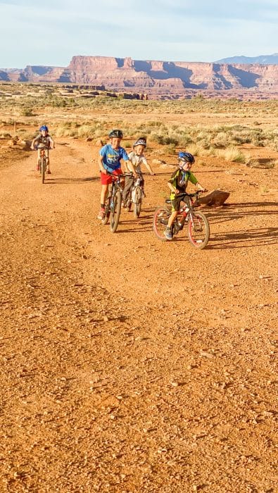 biking kids in the desert