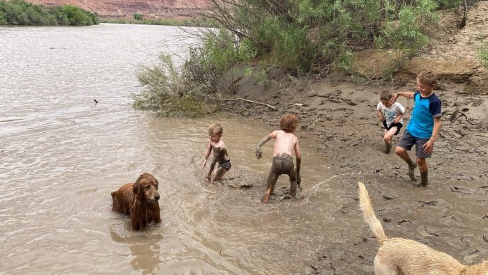 playing in the river at mineral botton canyonlands with kids